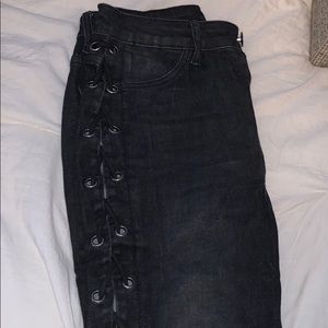 Entirely opened tied up black jeans